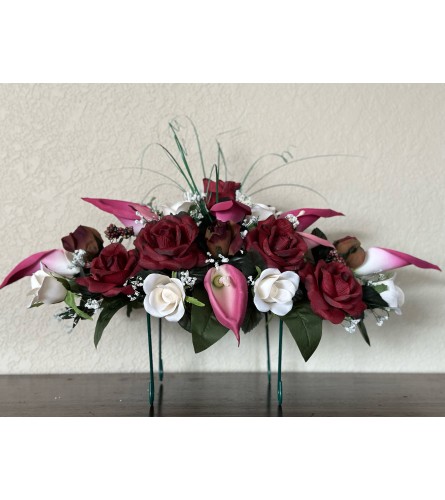 Plum Tombstone Saddle. An arrangement by Loyalist Flowers.