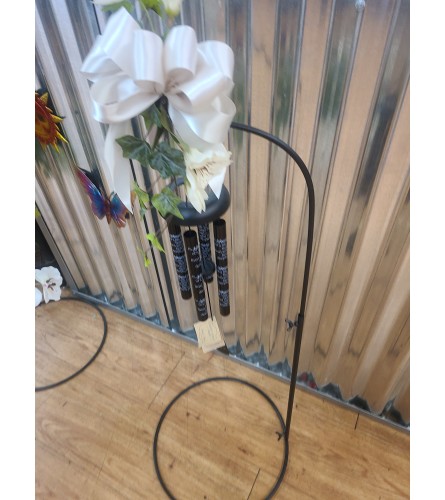 23 inch windchime on small shepherds hook with silk flowers. An arrangement by Flowers by Connie.