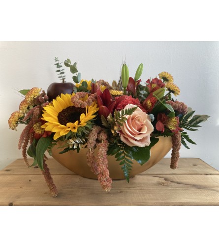 Harvest Warmth Centerpiece. An arrangement by Mayfield Flowers.