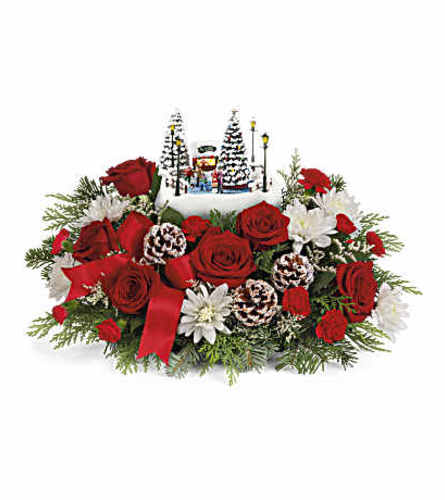 TF Thomas Kinkade's 2024 Skate into the Holidays - Deluxe. An arrangement by Nicol Florist.