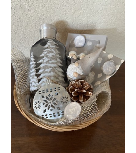 Gnome for the winter gift basket. An arrangement by Loyalist Flowers.