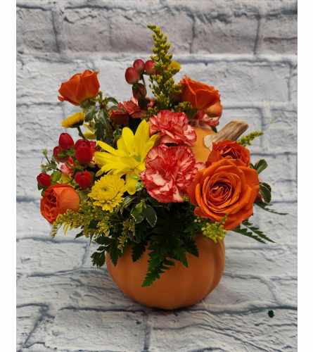Pumpkin Container. An arrangement by Clemmons Florist Inc..