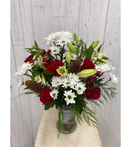 Winter Awakening (RR). An arrangement by Red Rose Incredible Florist.