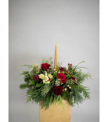 Traditional winter centrepiece. An arrangement by Enchanted Florist.