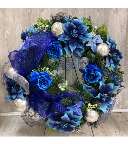 Blue Christmas Artificial Wreath. An arrangement by Roma Flowers and Gifts.