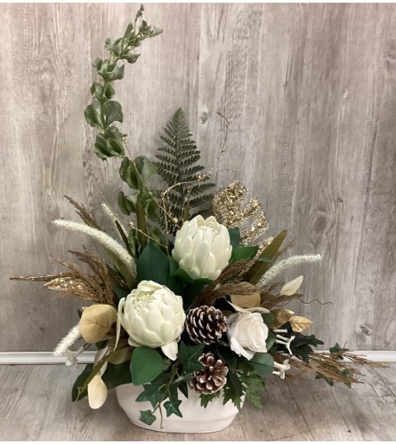 Golden Glory Artificial Christmas Arrangement. An arrangement by Roma Flowers and Gifts.