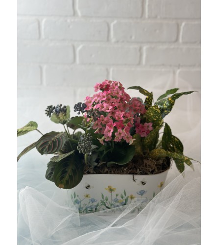 Tropical Garden in Bumblebee Pot. An arrangement by Brooklin Floral and Garden Shoppe Inc..