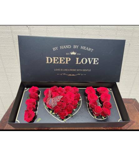 love box. An arrangement by Illusion Flower Shop.