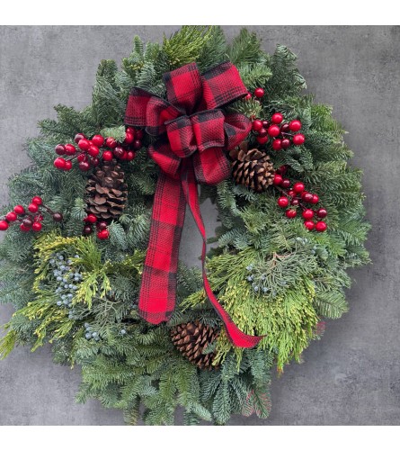 Fresh decorated wreath. An arrangement by DMP Flowers and Gifts.