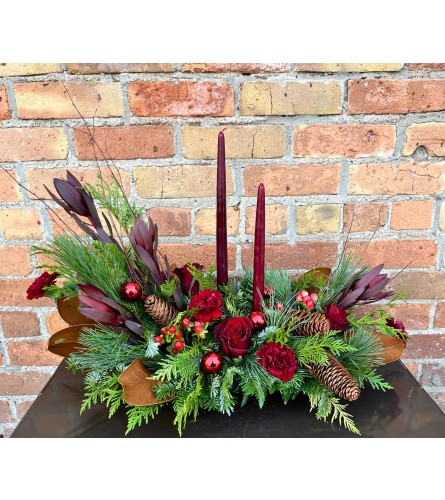 By Design Holiday Centerpiece - Deluxe. An arrangement by Flowers By Design.