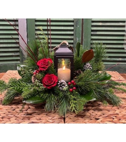 All is Bright Christmas/Winter Lantern Arrangement. An arrangement by Forest Florist.