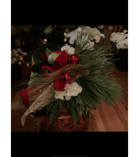 Sleigh Bell Red Centerpiece. An arrangement by Silver Rose Emotions.