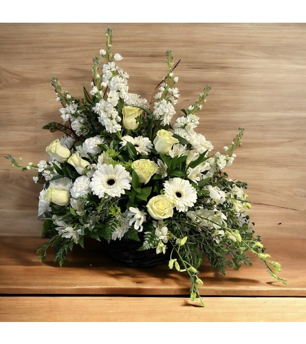 Serenity Basket Tribute. An arrangement by DMP Flowers and Gifts.