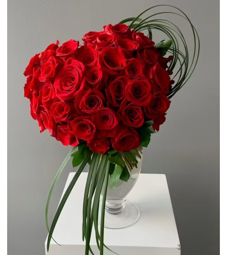Love in Bloom 50 Roses by Twig and Blooms. An arrangement by Twigs and Blooms Florist.