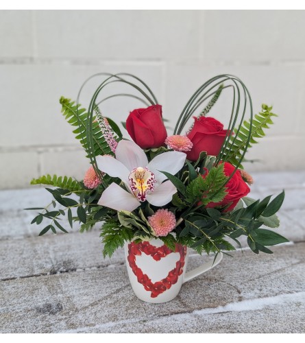 Love in a Mug. An arrangement by The Garden Gate Gifts and Florals.
