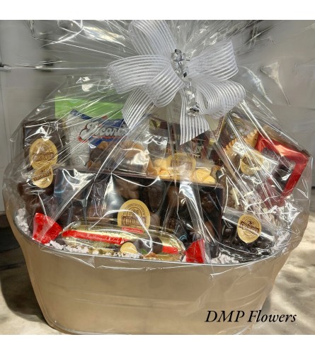 Large gourmet goodie basket. An arrangement by DMP Flowers and Gifts.