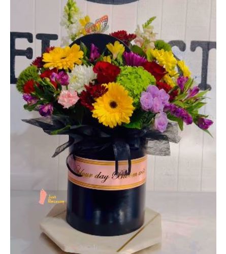 Colorful Whimsy Bouquet - Deluxe. An arrangement by Geni's Florist and Gifts.