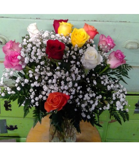 Classic dozen rose garden mixture. An arrangement by Rennix Flowers.