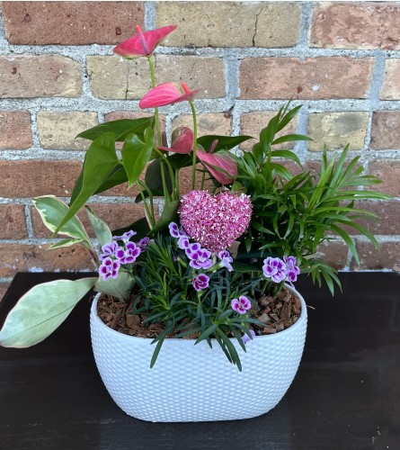 By Design The Pink Planter. An arrangement by Flowers By Design.