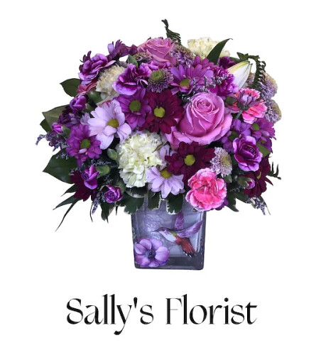 Sally’s Springtime Purple Bloom. An arrangement by Triple A Florist.
