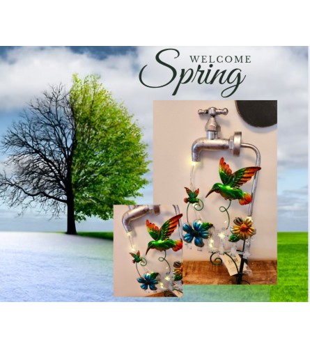 SOLAR HUMMING BIRD CHASING LIGHT WATER FAUCET STAKE 2. An arrangement by A Loving Touch Florist.
