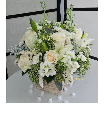 White in Pure. An arrangement by Doral Flower District and Design.