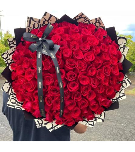 Buchon 100 Red Roses. An arrangement by Butterflies Flower Shop.