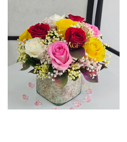 Lost in Rainbow Roses. An arrangement by Anthurium Gardens Florist.