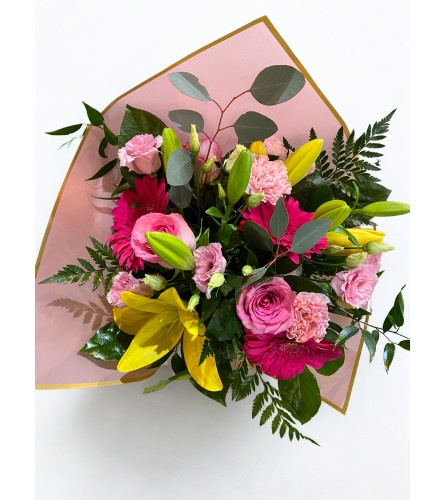 Brilliant Blooms — Wrapped Bouquet. An arrangement by Goodman's Florist.