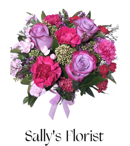 Sally’s Amour en Lavander. An arrangement by Triple A Florist.