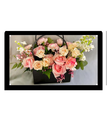 Luxurious Bag Bqt. An arrangement by Fifty Shades Of Flowers.