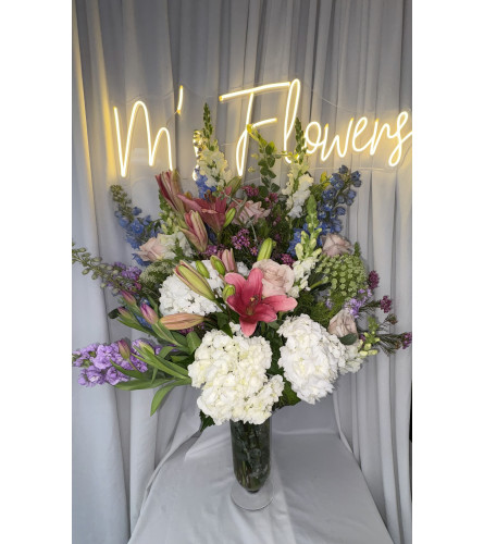 Pedistal Perfection 25. An arrangement by M's Flowers.