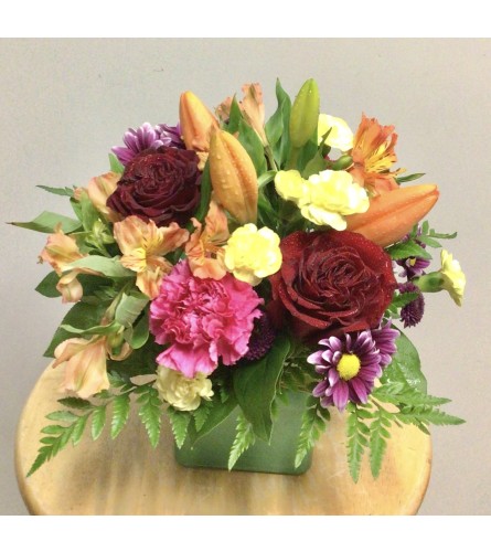 Orange Fest. An arrangement by Roma Flowers and Gifts.
