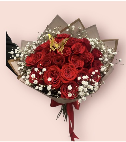 Biby Wrap Bouquet. An arrangement by Charming Blooms.