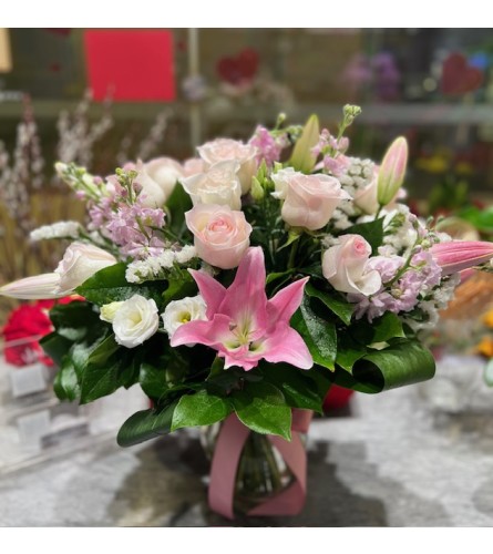 Enchanted Pink Embrace. An arrangement by Petals.