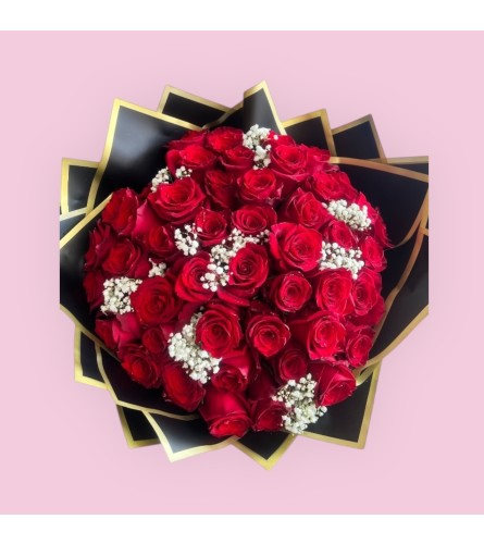 Red Ramo Buchon - Deluxe. An arrangement by Charming Blooms.