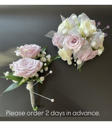 Lavender and White Mini Roses Corsage Duo. An arrangement by Violeta's Flower Shop.