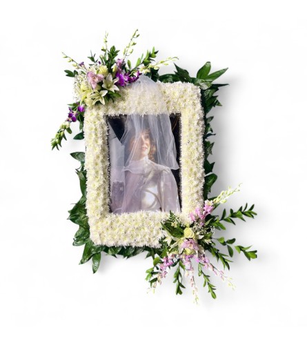 Floral Frame of Remembrance. An arrangement by Cinderella's Flowers.