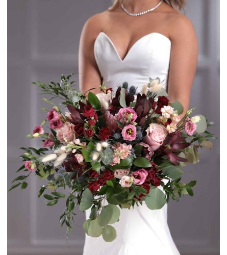 Wedding Burgundy boho style bridal bouquet. An arrangement by Timp Valley Floral.