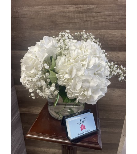 White Hydrangea and Baby’s Breath Arrangement. An arrangement by Sonia's Florist.