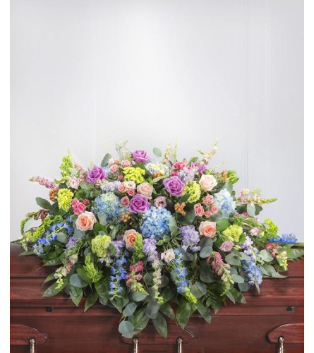 Pastel garden sympathy casket cover. An arrangement by Timp Valley Floral.