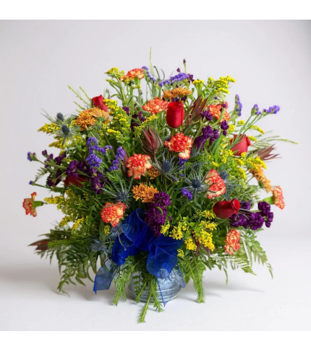 Into the wildflowers tribute. An arrangement by Rustic Floral and Gifts.