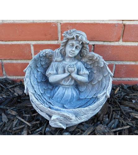 Statue - Rose Bowl Angel. An arrangement by Tom Rodgers Flowers.