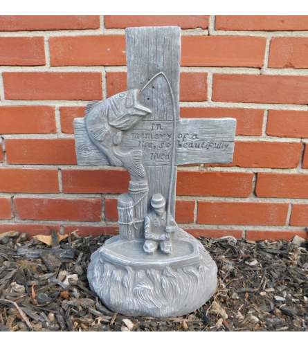 Statue - Fishing Cross. An arrangement by Tom Rodgers Flowers.