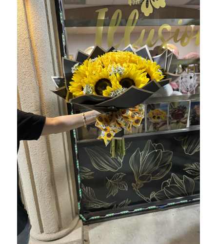 Sunshine. An arrangement by Illusion Flower Shop.