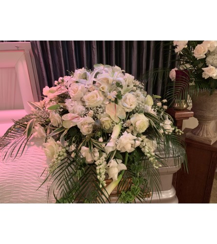 Heavenly White Tribute. An arrangement by Simply Beautiful Flowers and Events.