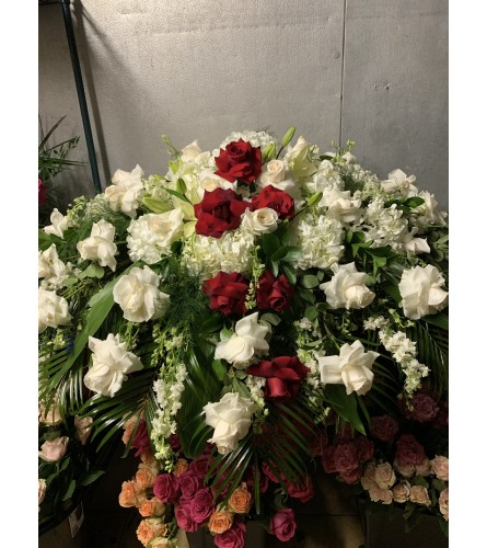 Crimson and Ivory Embrace. An arrangement by Simply Beautiful Flowers and Events.