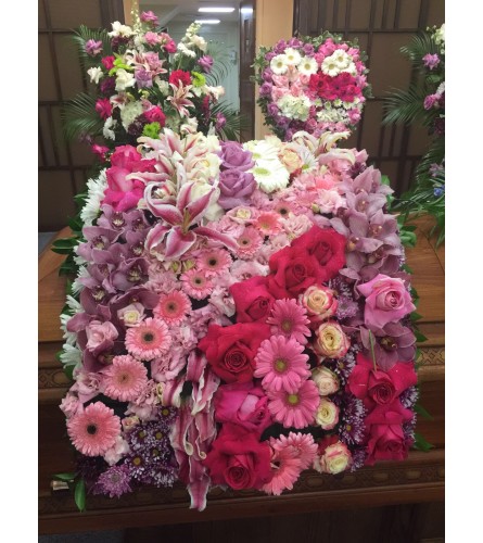 Blanket of Blossoms. An arrangement by Simply Beautiful Flowers and Events.