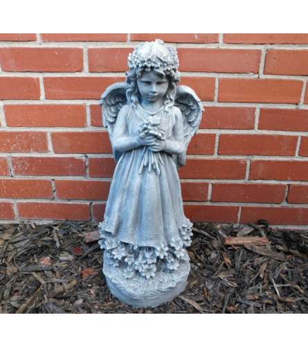 Bouquet Angel Statue. An arrangement by North Liberty Flower Shop.
