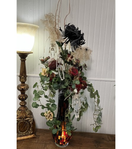 Eternal Bloom and Bones. An arrangement by The Flower Box Florist.